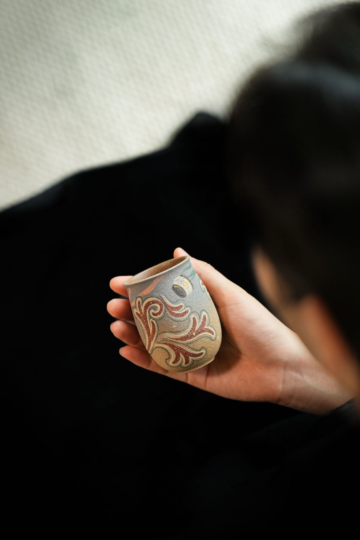 Tall tea cup with flowing Dunhuang-inspired decoration