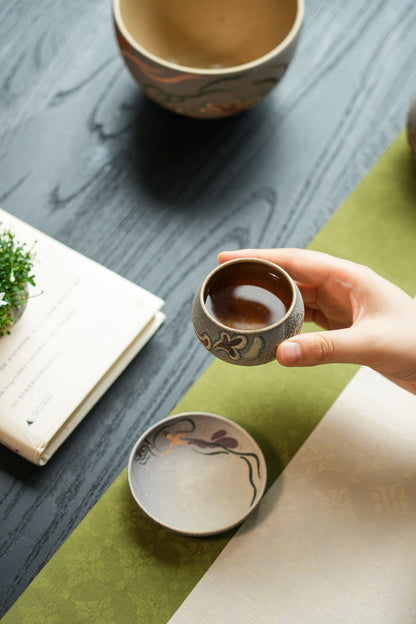 Short tea cup and matching cup saucer