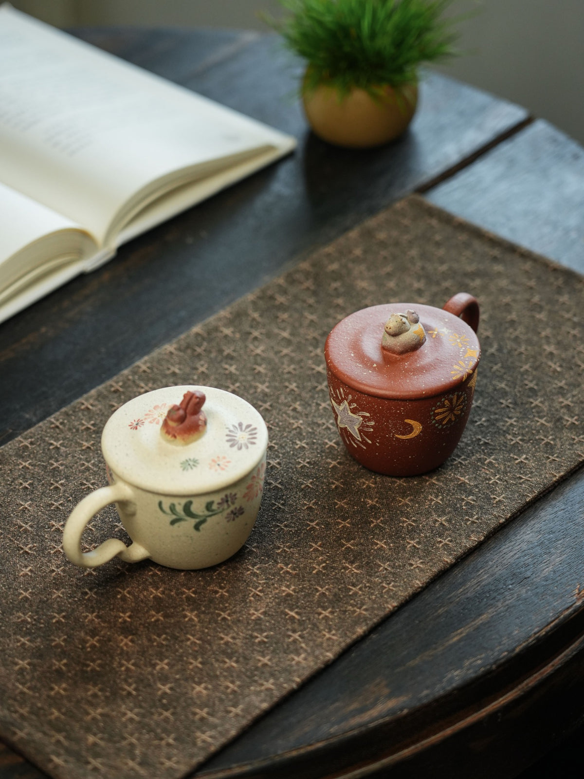 White and red clay Niu Ma lidded cups; each sold separately