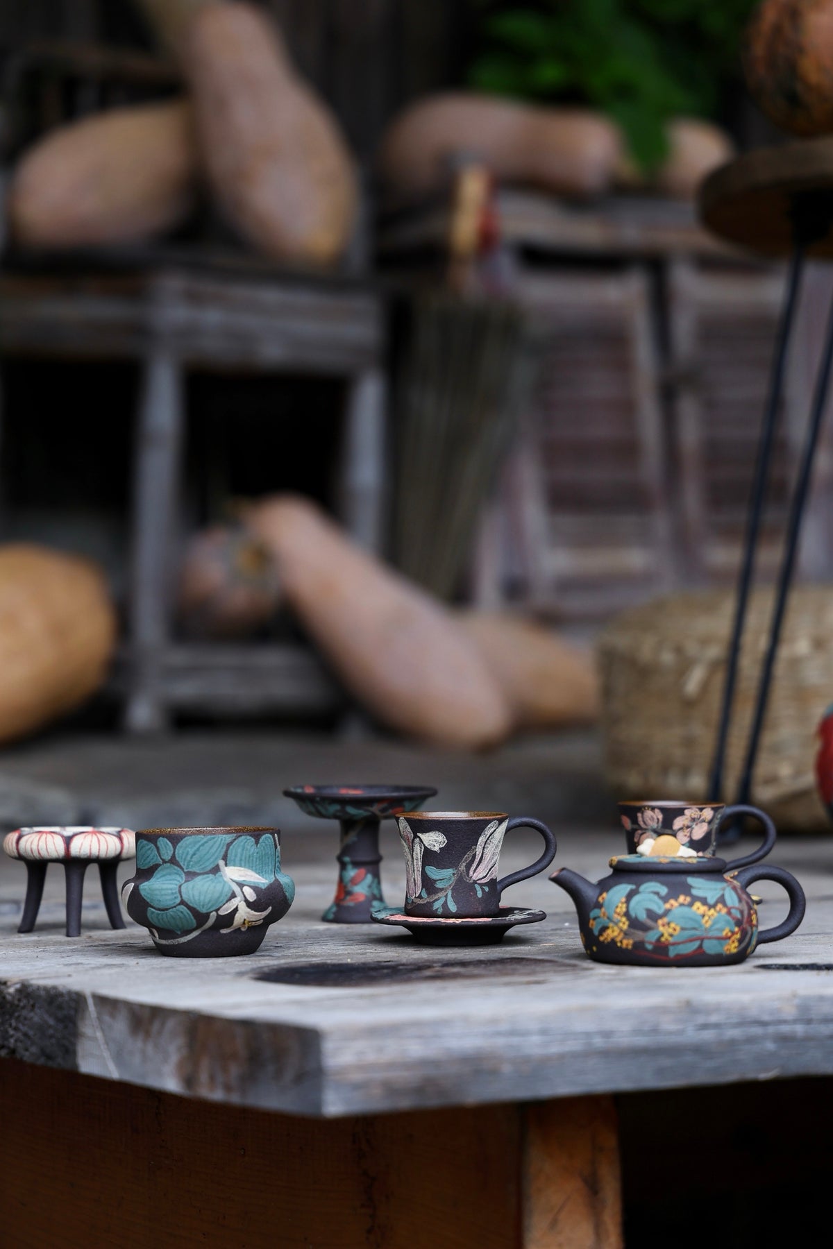 Teapot cups and accessories displayed together