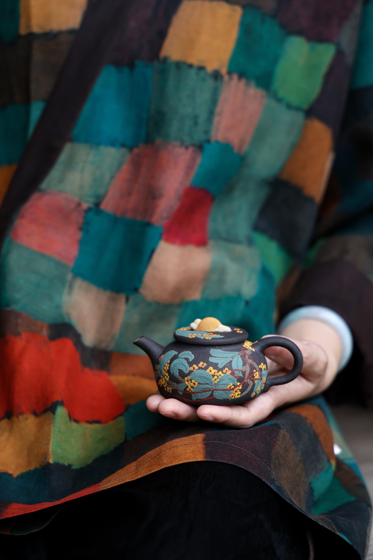 Liu Susu floral teapot held in one hand