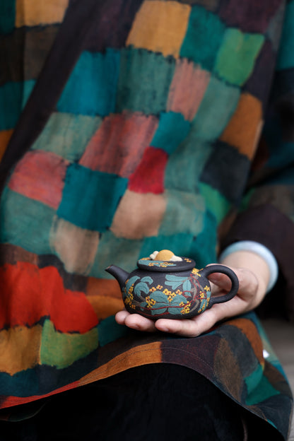 Liu Susu floral teapot held in one hand