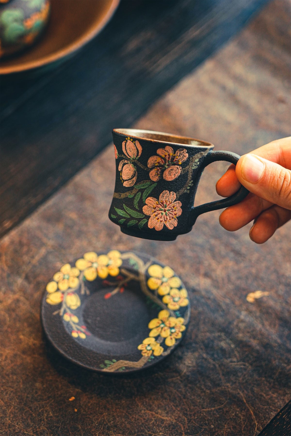 Pink floral handled cup and yellow floral saucer