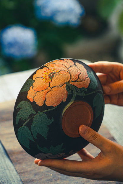 Floral decoration on the underside of the large bowl
