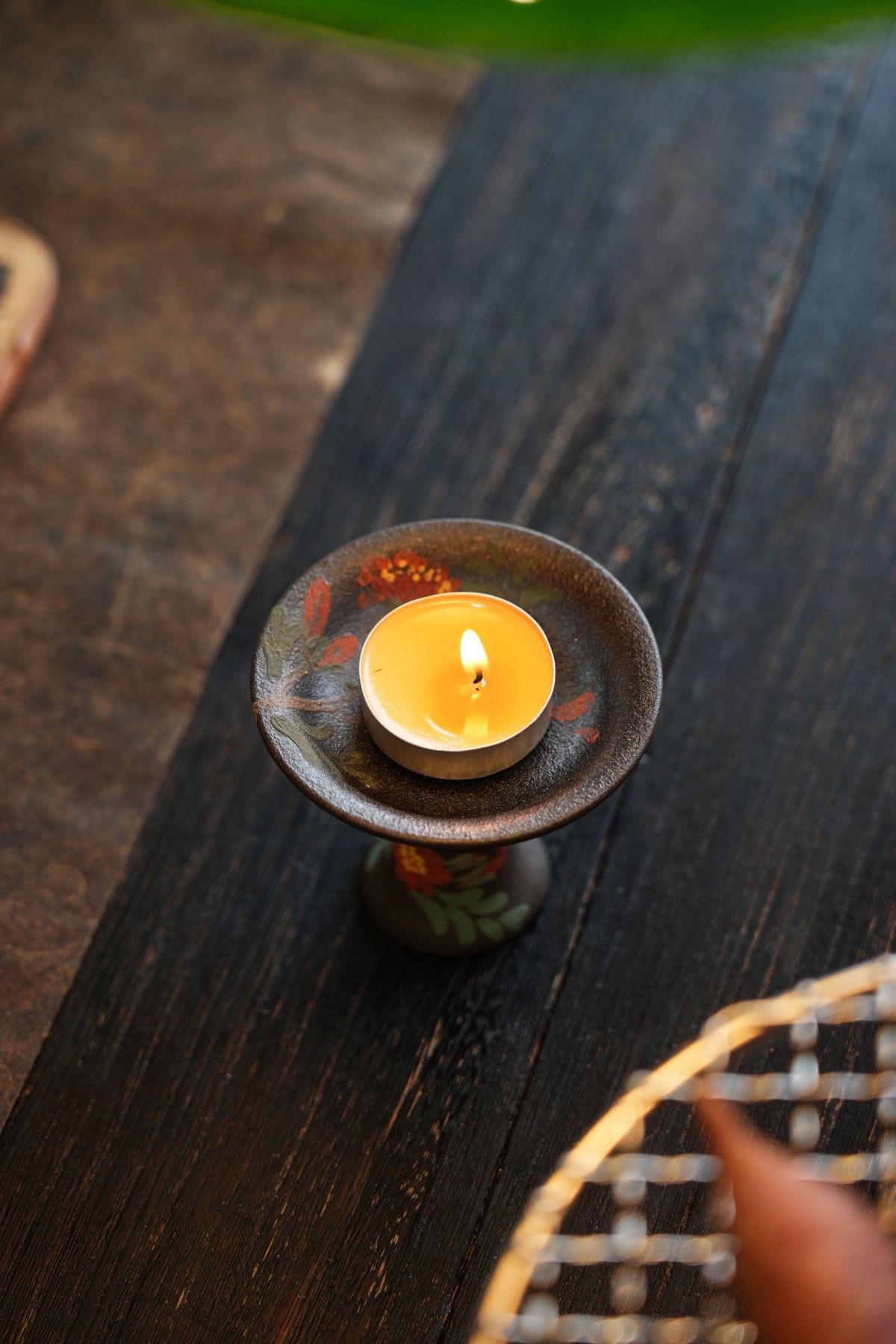 Overhead view of floral candleholder with tea light
